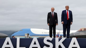 Russian President Vladimir Putin and U.S. President Donald Trump pose on a podium on the tarmac after they arrived to attend a meeting at Joint Base Elmendorf-Richardson in Anchorage, Alaska, U.S., August 15, 2025. Sputnik/Gavriil Grigorov/Pool via REUTERS ATTENTION EDITORS - THIS IMAGE WAS PROVIDED BY A THIRD PARTY. TPX IMAGES OF THE DAY