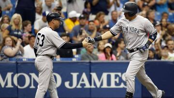Jul 31, 2016; St. Petersburg, FL, USA; New York Yankees right fielder Carlos Beltran (36) is congratulated by third base coach Joe Espada (53) after hitting a two-run home run during the sixth inning against the Tampa Bay Rays at Tropicana Field. Mandatory Credit: Kim Klement-USA TODAY Sports