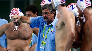 Croatia's head coach Ratko Rudic (C) talks to his players during a break in their men's water polo quarter-final match against Montenegro at the 14th FINA World Championships in Shanghai July 26, 2011. REUTERS/Issei Kato (CHINA  - Tags: SPORT WATER POLO AQUATICS)