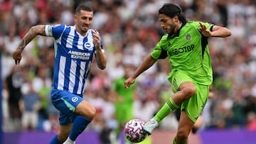 Brighton's English defender #05 Lewis Dunk (L) chases Fulham's Mexican striker #07 Raul Jimenez (R) during the English Premier League football match between Brighton and Hove Albion and Fulham at the American Express Community Stadium in Brighton, southern England on August 16, 2025. (Photo by Glyn KIRK / AFP) / RESTRICTED TO EDITORIAL USE. No use with unauthorized audio, video, data, fixture lists, club/league logos or 'live' services. Online in-match use limited to 120 images. An additional 40 images may be used in extra time. No video emulation. Social media in-match use limited to 120 images. An additional 40 images may be used in extra time. No use in betting publications, games or single club/league/player publications. /