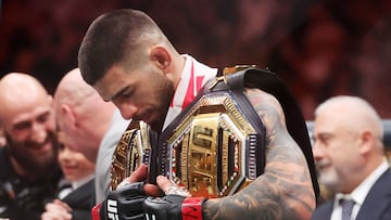 LAS VEGAS, NEVADA - JUNE 28: Ilia Topuria of Georgia looks on after knocking out Charles Oliveira of Brazil to win the lightweight main event title in the first round during UFC 317 at T-Mobile Arena on June 28, 2025 in Las Vegas, Nevada. Ian Maule/Getty Images/AFP (Photo by Ian Maule / GETTY IMAGES NORTH AMERICA / Getty Images via AFP)
