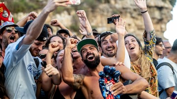 Carlos Gimeno (foreground) of Spain celebrates with spectators during the final competition day of the second stop of the Red Bull Cliff Diving World Series in Polignano a Mare, Italy on 29.06.2025.