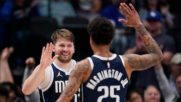 Luka Doncic #77 of the Dallas Mavericks is congratulated by P.J. Washington #25 after a score during the first half against the Oklahoma City Thunder at American Airlines Center on February 10, 2024 in Dallas, Texas.