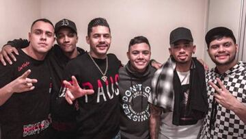 Brazil player Gabriel Jesus poses for a photo at the party with Eduardo Bastos and rappers Hungría and Misael.