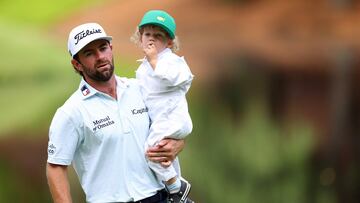 AUGUSTA, GEORGIA - APRIL 10: Cameron Young of the United States holds his son, Henry, on the ninth green during the Par Three Contest prior to the 2024 Masters Tournament at Augusta National Golf Club on April 10, 2024 in Augusta, Georgia. Andrew Redington/Getty Images/AFP (Photo by Andrew Redington / GETTY IMAGES NORTH AMERICA / Getty Images via AFP)