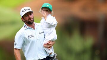 AUGUSTA, GEORGIA - APRIL 10: Cameron Young of the United States holds his son, Henry, on the ninth green during the Par Three Contest prior to the 2024 Masters Tournament at Augusta National Golf Club on April 10, 2024 in Augusta, Georgia.   Andrew Redington/Getty Images/AFP (Photo by Andrew Redington / GETTY IMAGES NORTH AMERICA / Getty Images via AFP)