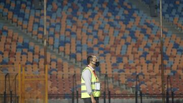 Soccer Football - Egyptian Premier League - Pyramids FC v Al Ahly - Cairo International Stadium, Cairo, Egypt - October 11, 2020 General view of a steward wearing a face mask outside the stadium before the match REUTERS/Amr Abdallah Dalsh