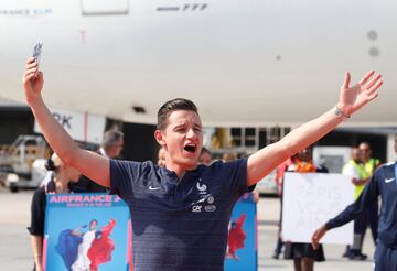 Soccer Football - World Cup - The France team return from the World Cup in Russia - Charles de Gaulle Airport, Paris, France - July 16, 2018   France's Florian Thauvin gestures as he arrives  