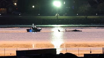 Rescuers on a boat work next to the wreckage of a Black Hawk helicopter, as the sun rises, at the site of the crash after it collided with the American Eagle flight 5342, which was approaching Reagan Washington National Airport, and crashed into the Potomac River, outside Washington, U.S., January 30, 2025. REUTERS/Kevin Lamarque TPX IMAGES OF THE DAY