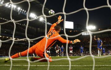 Eden Hazard scores their first goal from the penalty spot.