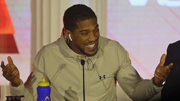 British boxer Anthony Joshua gestures during a press conference ahead of his boxing fight against Cameroonian-French boxer Francis Ngannou at the Kingdom Arena in Riyadh on March 6, 2024. (Photo by Fayez Nureldine / AFP)