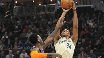 Dec 2, 2019; Milwaukee, WI, USA; Milwaukee Bucks forward Giannis Antetokounmpo (34) shoots over New York Knicks forward Bobby Portis (1) in the first quarter at Fiserv Forum. Mandatory Credit: Michael McLoone-USA TODAY Sports