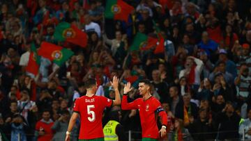 Soccer Football - Nations League - Group Stage - Portugal v Poland - Estadio do Dragao, Porto, Portugal - November 15, 2024 Portugal's Cristiano Ronaldo celebrates with Diogo Dalot after scoring their fifth goal REUTERS/Pedro Nunes