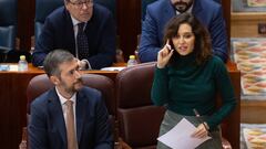 El consejero de Presidencia, Justicia y Administración Local, Miguel Ángel García y la presidenta de la Comunidad de Madrid, Isabel Díaz Ayuso, interviene durante el pleno de la Asamblea de Madrid, a 7 de diciembre de 2023, en Madrid (España).  La Economía y la Hacienda de la Comunidad de Madrid centran el Pleno de la Asamblea de Madrid, que debate la deflactación del Impuesto sobre la Renta de las Personas Físicas (IRPF), la eliminación en 2024 del Impuesto de Patrimonio y las enmiendas a la totalidad de Más Madrid y PSOE a los Presupuestos Regionales para 2024.  En el caso de Patrimonio se trata de una modificación para 2024 con el objetivo de que el dinero que recaudaría el Estado por el llamado 'impuesto de solidaridad a las grandes fortunas' se quede en Madrid, eliminando la exención de este tributo a los que tengan más de 3 millones de patrimonio.
07 DICIEMBRE 2023;IRPF;IMPUESTO DE PATRIMONIO;ASAMBLEA
Marcos Villaoslada  / Europa Press
07/12/2023