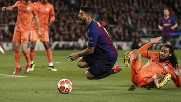 Barcelona's Uruguayan forward Luis Suarez (L) is fouled by Lyon's Belgian defender Jason Denayer during the UEFA Champions League round of 16, second leg football match between FC Barcelona and Olympique Lyonnais at the Camp Nou stadium in Barce