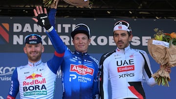 (LtoR) Red Bull-BORA-hansgrohe's cyclist Jordi Meeus (runner-up), Alpecin-Premier Tech's cyclist Jasper Philipsen (winner) and UAE Team Emirates-XRG's cyclist Juan Sebastian Molano (third placed) pose on the podium after the Nokere Koerse one-day cycling race in Kruisem on March 18, 2026. (Photo by DAVID PINTENS / Belga / AFP) / Belgium OUT