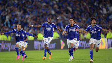 Millonarios' players celebrate after defeating Atletico Nacional during the Colombian First Division Football Championship final match between Millonarios and Atletico Nacional at the El Campin stadium in Bogota on June 24, 2023. (Photo by Raul ARBOLEDA / AFP)