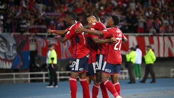 Medellin players celebrate their first goal during the Copa Sudamericana round of 16 second leg football match between Colombia's Independiente Medellin and Chile's Palestino at the Hernan Ramirez Villegas stadium in Pereira, Colombia on August 21, 2024. (Photo by Raul ARBOLEDA / AFP)