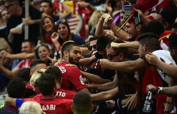 Carrasco celebrates his opener with Atleti fans