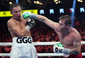 Sep 17, 2022; Las Vegas, Nevada, USA; Canelo Alvarez (red trunks) and Gennadiy Golovkin (white trunks) box during a super middleweight championship bout at T-Mobile Arena. Mandatory Credit: Joe Camporeale-USA TODAY Sports     TPX IMAGES OF THE DAY