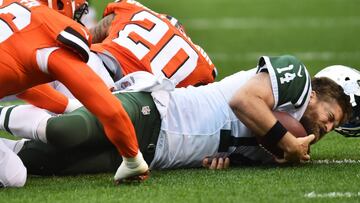 Oct 30, 2016; Cleveland, OH, USA; New York Jets quarterback Ryan Fitzpatrick (14) loses his helmet on a hit by Cleveland Browns cornerback Briean Boddy-Calhoun (20) during the first quarter at FirstEnergy Stadium. Mandatory Credit: Ken Blaze-USA TODAY Sports