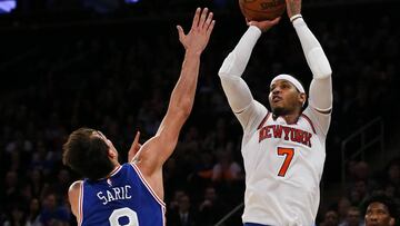 Feb 25, 2017; New York, NY, USA;  New York Knicks forward Carmelo Anthony (7) makes the game winning shot against Philadelphia 76ers forward Dario Saric (9) during second half at Madison Square Garden. The New York Knicks defeated the Philadelphia 76ers 110-109.
 Mandatory Credit: Noah K. Murray-USA TODAY Sports