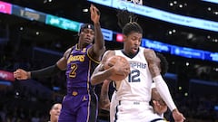 Memphis Grizzlies guard Ja Morant (12) grabs a rebound in front of Los Angeles Lakers forward Jarred Vanderbilt (2).