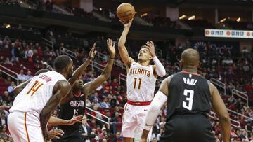 Feb 25, 2019; Houston, TX, USA; Atlanta Hawks guard Trae Young (11) shoots the ball as Houston Rockets center Clint Capela (15) defends during the fourth quarter at Toyota Center. Mandatory Credit: Troy Taormina-USA TODAY Sports