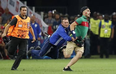 Pitch invader at Portugal match tries to hug Cristiano Ronaldo
