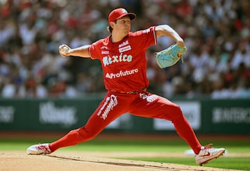 Mexico's Diablos Rojos Trevor Bauer throws the ball during the first inning of the first exhibition baseball game against New York Yankees at the Alfredo Harp Helu stadium in Mexico City on March 24, 2024. (Photo by ALFREDO ESTRELLA / AFP)