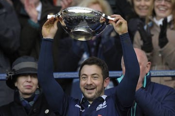 Scotland's scrum-half Greig Laidlaw holds up the cup after winning the Six Nations international rugby union match between Scotland and Ireland at Murrayfield