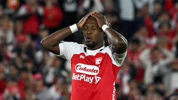 Santa Fe's forward #11 Hugo Rodallega reacts after missing a scoring opportunity during the first leg of the Colombian football championship final between Independiente Santa Fe and Independiente Medellin at the Nemesio Camacho El Campin Stadium in Bogota on June 24, 2025. (Photo by Luis ACOSTA / AFP)