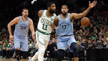 Boston Celtics' Kyrie Irving throws a behind-the-back pass past Memphis Grizzlies' Garrett Temple (17) during the first quarter of an NBA basketball game Friday, Jan. 18, 2019, in Boston. (AP Photo/Winslow Townson)