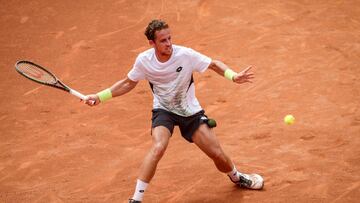 Spain�s Roberto Carballes Baena returns the ball to UK's Daniel Evans during the men's single semi-final tennis match at the Marrakesh open, on April 8, 2023. (Photo by FADEL SENNA / AFP)