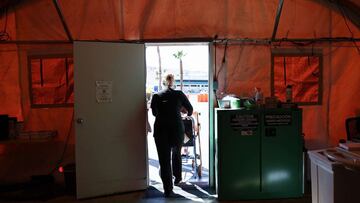 APPLE VALLEY, CALIFORNIA - MARCH 11: (EDITORIAL USE ONLY) A patient is wheeled out of the triage tent at Providence St. Mary Medical Center on March 11, 2022 in Apple Valley, California. The hospital was treating 125 confirmed COVID-19 patients at the peak of the Omicron surge but has seen a sharp decline and is currently caring for 13 confirmed coronavirus patients. The hospital is planning to take down the triage tent next week as cases decline and operations return to normal. Today marks the two year anniversary of the World Health Organizationx92s official declaration of the COVID-19 pandemic. Mario Tama/Getty Images/AFP
== FOR NEWSPAPERS, INTERNET, TELCOS & TELEVISION USE ONLY ==