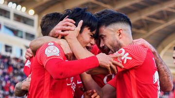 MALLORCA, SPAIN - JANUARY 15: Take Kubo of RCD Mallorca celebrates scoring his team's first goal with his teammates during the round of 16 of the Copa del Rey match between RCD Mallorca and RCD Espanyol at Iberostar Stadium on January 15, 2022 in Ma