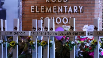 Flowers are placed on a make shift memorial outside Robb Elementary School in Uvalde, Texas, on May 25, 2022.