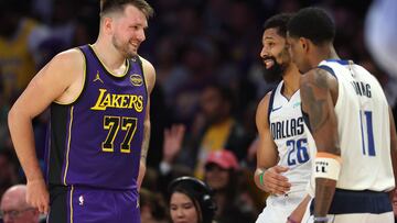 LOS ANGELES, CALIFORNIA - FEBRUARY 25: Luka Doncic #77 of the Los Angeles Lakers shares a laugh with Kyrie Irving #11 and Spencer Dinwiddie #26 of the Dallas Mavericks during the first half of a game at Crypto.com Arena on February 25, 2025 in Los Angeles, California. Sean M. Haffey/Getty Images/AFP (Photo by Sean M. Haffey / GETTY IMAGES NORTH AMERICA / Getty Images via AFP)