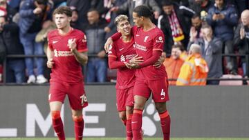Liverpool's Roberto Firmino, center, celebrates scoring their side's fifth goal of the game during the English Premier League soccer match between Watford and Liverpool at Vicarage Road, Watford, England, Saturday, Oct. 16, 2021. (Tess Derry/PA