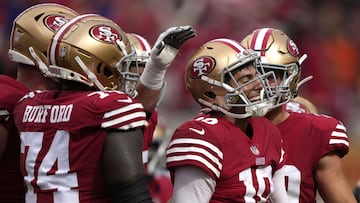 SANTA CLARA, CALIFORNIA - SEPTEMBER 18: Jimmy Garoppolo #10 of the San Francisco 49ers reacts after scoring a touchdown against the Seattle Seahawks during the fourth quarter at Levi's Stadium on September 18, 2022 in Santa Clara, California.   Thearon W. Henderson/Getty Images/AFP