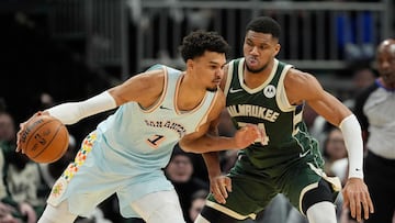 MILWAUKEE, WISCONSIN - JANUARY 08: Giannis Antetokounmpo #34 of the Milwaukee Bucks defends Victor Wembanyama #1 of the San Antonio Spurs during the second quarter at Fiserv Forum on January 08, 2025 in Milwaukee, Wisconsin. NOTE TO USER: User expressly acknowledges and agrees that, by downloading and or using this photograph, User is consenting to the terms and conditions of the Getty Images License Agreement. Patrick McDermott/Getty Images/AFP (Photo by Patrick McDermott / GETTY IMAGES NORTH AMERICA / Getty Images via AFP)