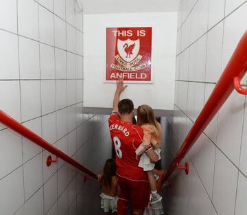 Steven Gerrard of Liverpool touches the famous sign before Liverpool's home game against Crystal Palace at Anfield on May 16 2015 - his last game for the club.