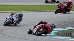 MotoGP - Malaysian Grand Prix - Sepang International Circuit, Sepang, Malaysia - November 12, 2023  Ducati Lenovo Team's Enea Bastianini and Gresini Racing MotoGP's Alex Marquez in action during the race REUTERS/Hasnoor Hussain