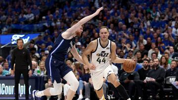 DALLAS, TEXAS - APRIL 16: Bojan Bogdanovic #44 of the Utah Jazz drives to the basket against Davis Bertans #44 of the Dallas Mavericks in the fourth quarter at American Airlines Center on April 16, 2022 in Dallas, Texas.