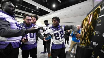 Los Angeles, CA - January 07:  TCU Horned Frogs players take pictures National Championship trophy for during media day for the College Football Playoff championship game at the Los Angeles Convention Center in Los Angeles on Saturday, January 7, 2023. (Photo by Keith Birmingham/MediaNews Group/Pasadena Star-News via Getty Images)