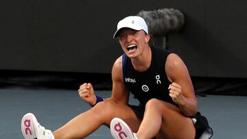 Poland's Iga Swiatek celebrates winning her final match against Jessica Pegula of the U.S