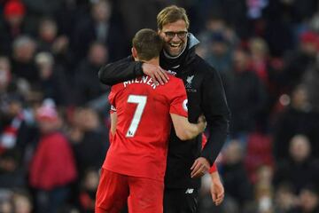 Liverpool's German manager Jurgen Klopp embraces James Milner who went to Anfield from Man City.