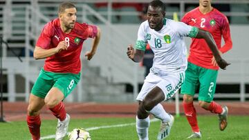 Morocco's midfielder Adel Taarabt (L) is marked by Mauritania's midfielder Hacen El Ide during the 2021 Africa Cup of Nations group E qualifying football match between Morocco and Mauritania at the Prince Moulay Abdellah stadium in the capital R
