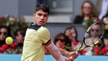 Spain's Carlos Alcaraz returns the ball to Russia's Alexander Shevchenko during the 2024 ATP Tour Madrid Open tennis tournament singles match at Caja Magica in Madrid on April 26, 2024. (Photo by Thomas COEX / AFP)