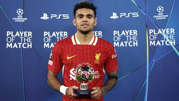 LIVERPOOL, ENGLAND - NOVEMBER 05: Luis Diaz of Liverpool poses for a photo after being awarded the PlayStation Player of the Match at full-time following the team's victory in the UEFA Champions League 2024/25 League Phase MD4 match between Liverpool FC and Bayer 04 Leverkusen at Anfield on November 05, 2024 in Liverpool, England. (Photo by Naomi Baker - UEFA/UEFA via Getty Images)
